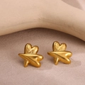 Macro shot of gold-plated stainless steel stud earrings with cross texture detail - Cross Overlay