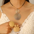 Close-up of golden hammered metal disk jewelry set with necklace and earrings - Necklace Earrings Ring 3-Piece Set / Gold
