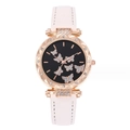Detail of rose gold watch case with crystal bezel and butterfly motif on black dial - White