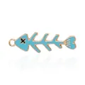 Sky blue fishbone charm with gold metal edges and hanging loop for DIY jewelry - Fishbone