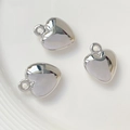 Polished silver heart-shaped resin pendants in a ceramic dish for DIY jewelry - 20# White K Heart 20