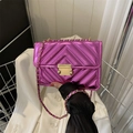 Detail of purple metallic crossbody bag with diamond quilting and gold chain strap - Rose Pink