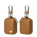 Brown leather AirPods case with silver zipper and carabiner clip in two-piece view - Tan