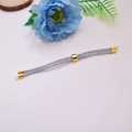 Gray Milan cord bracelet with 18K gold-plated adjustable beads and hardware on white background - Silver Gray