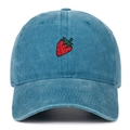 Detailed close-up of red strawberry embroidery on a blue washed cotton baseball cap - Lake Blue