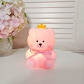 Pink cartoon bear night light with yellow crown and plaid bow in a cozy home setting - Nini Bear - Pink - Pink