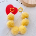 Detail of yellow plush balls and white faux pearl chain with round spring buckles - Yellow