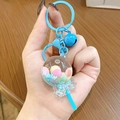 Cute sky blue lollipop keychain featuring liquid glitter and heart-shaped carabiner clip - Blue Lollipop Milk Bean