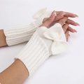 White knit fingerless gloves with a large bow detail for a sweet feminine style - White