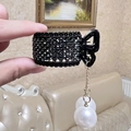 Detail of black rhinestone hair claw with hanging gold chain and white pearl pendants - Tassel Black Rhinestone