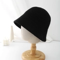 Detailed knit texture of a chic black bucket hat on a wooden mannequin head - Adjustable / Black