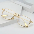 Minimalist gold square metal eyeglass frames displayed on geometric white stone pedestal - Non-Prescription Blue Light Blocking / Gold