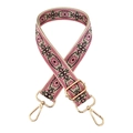 Close-up of pink geometric ethnic style woven canvas bag strap with gold metal hardware - Black and Rose on Beige Base