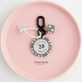 Close-up of Monte Carlo poker chip keychain with silicone strap and lucky dice - Grey Beige-20 Value