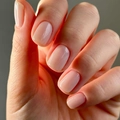 Glossy light pink square nails with a natural nude gel finish on hand close-up - Glue Type / Nude Pink (JP3363)