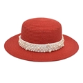 Flat top red straw sun hat for women featuring elegant pearl accents and ribbon - Red