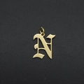 Detailed view of an Old English letter N charm in gold-plated stainless steel - Letter N