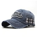 Detail of vintage washed denim baseball cap featuring white Jeans embroidery and frayed edges - 56-60cm / Navy Blue