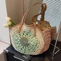 Handcrafted straw shoulder bag featuring beige and green spiral weave with leather straps - Green