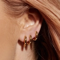 Three-piece set of elegant golden hoop earrings with cubic zirconia on a female model - 5930501/Gold Hoop 3-Piece Set