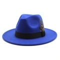 Macro shot of royal blue wool fedora hat with black ribbon and natural feather detail - Sapphire Blue