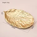 Goldenes Tablett in Federform mit Blattstruktur, Größe 29,5 cm x 18 cm x 3 cm - Langes Federblatt-Tablett