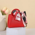 Elegant red leather wedding favor gift bag with a decorative printed silk scarf handle - Red