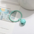 Mint green metal key ring with matching bell pendant on a minimalist background - Mint Green