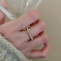 Close-up of elegant gold pearl ring on finger with soft aesthetic lighting - Bamboo Band Multi-Pearl Ring / 9# Gold-Bamboo Pearl