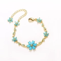 Gold flower bracelet featuring blue teardrop stones and an adjustable extension chain - Gold-Turquoise Color