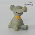 Vintage Elefant Schaukelstuhl Ornament mit gelbem Schal als Schreibtischdeko - Elefant