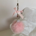 Pink plush ball keychain featuring a satin bow and a silver star charm for phone - Pink