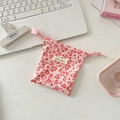 Close-up of heart leopard print canvas drawstring pouch with pink ribbon and brand label - Corduroy Leopard Heart Pink