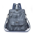 Zaino multifunzionale blu scuro texture denim con spallacci regolabili e tasche multiple - Blu