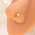 Macro shot of gold flower nose ring with sparkling rhinestones on model face - E4810-2/Gold/Flower Shape