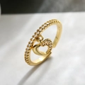 Elegant gold-plated open heart ring with sparkling cubic zirconia on marble background - Adjustable Open / Gold