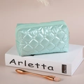 Chic mint green quilted down makeup bag with elegant diamond stitching for daily beauty - Light Blue