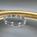 Silver beaded bracelet with white evil eye charms on reflective mirror surface - Black White Eye - Silver