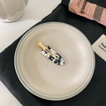 Elegante zwart-witte marmeren acetaat haarklem met gouden metalen basis voor dames - Koeienprint