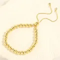 Polished 18K gold plated copper bead bracelet with adjustable sliding zircon closure - 6mm Bead Diameter