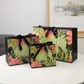 Black and green floral gift bags in three sizes with gold handles and black ribbon bow - S / Black Ribbon
