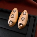 Vintage matte gold oval drop earrings with three champagne crystals on black leather - Gold Champagne Brushed Style