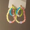 Detailed close-up of colorful beaded double hoop earrings with a gold stud fastening - 6# Gold Colorful Bead Hoops (Silver Pin)
