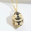 Elegant gold egg pendant necklace with black and white enamel floral pattern detail - Black (XL3225 Black)