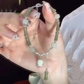 Exquisite beaded bracelet with green sea blue beads and bamboo flower charms on hand - S186 Bamboo Lily Of The Valley Bracelet #sz452