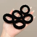 Set of five thick black textured elastic hair ties for high ponytail styling held in hand - OPP Bag Packed / 15# Black