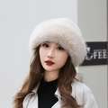 Thick beige faux fur earmuff hat with plush fluffy texture for winter warmth - Beige