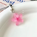 Cute pink floral keychain with a subtle shimmer, resin flower charm on white ceramic plate - Colorful Transparent Daisy Phone Lanyard / Rose Red