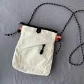 Unisex κρέμ πάνινη τσάντα χιαστί utility με πορτοκαλί ιμάντα και υφαντό κορδόνι ώμου - Ζαχαρί