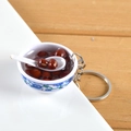 Miniature blue and white porcelain bowl keychain with realistic red bean soup - Red Bean Soup
